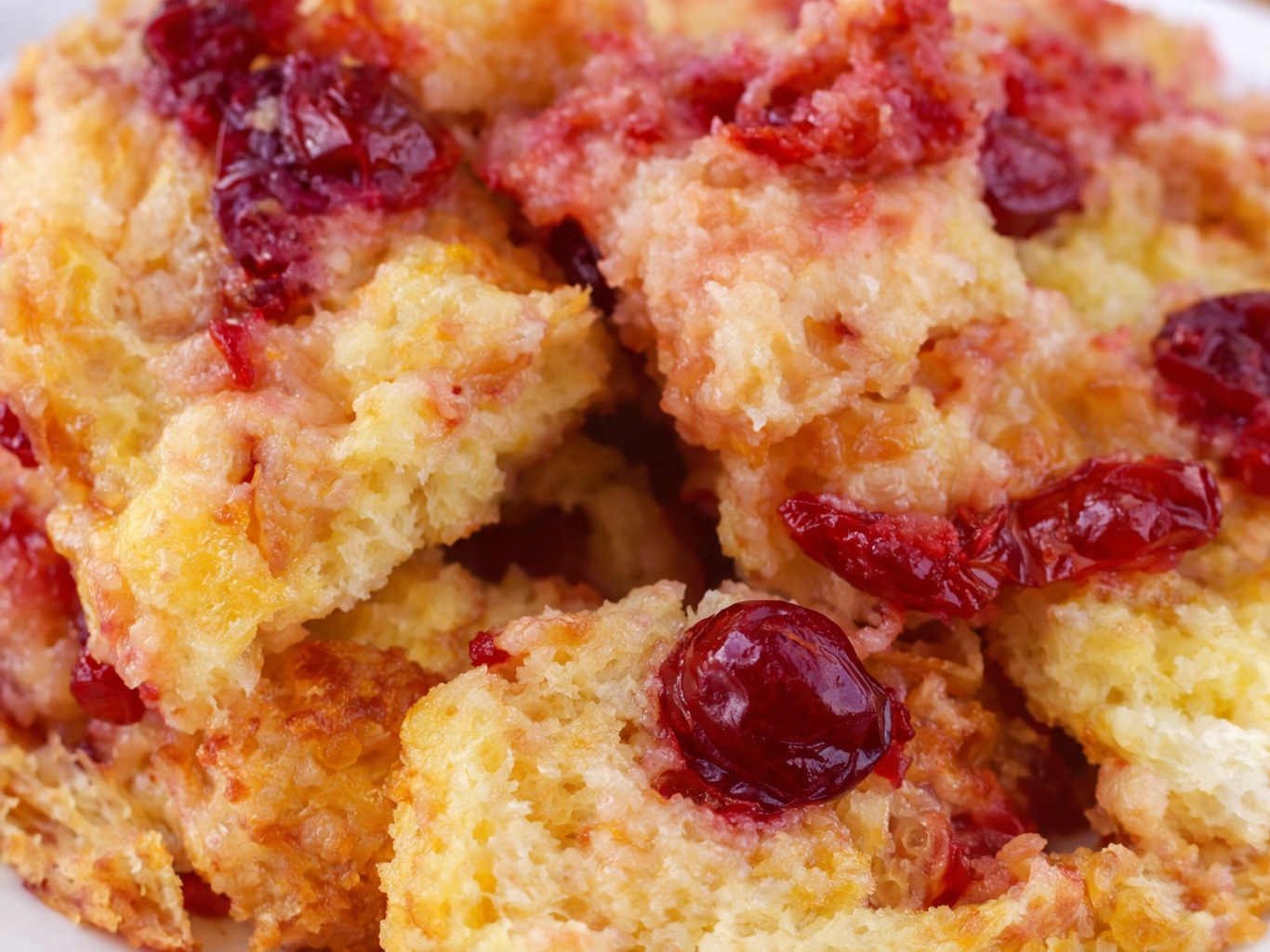 Close-up of bread pudding topped with cranberries