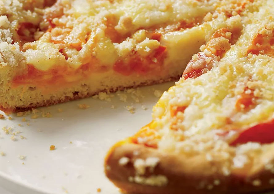 Slices of apricot crumb pie on a plate