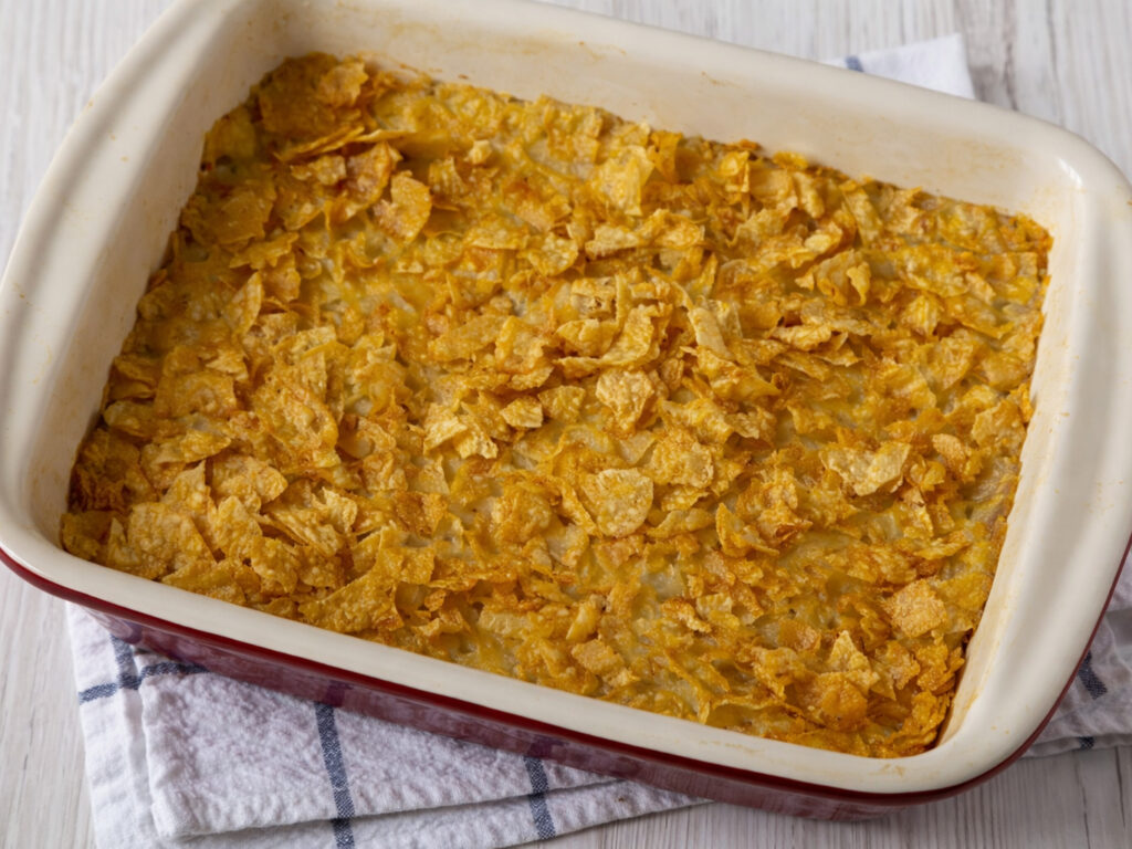 Baked casserole topped with crushed cornflakes in a rectangular dish