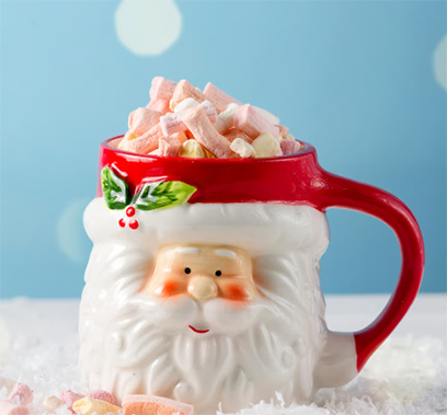 Santa-shaped mug filled with a festive drink and topped with mini marshmallows.