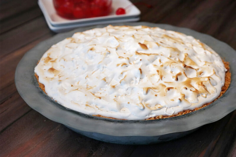 Baked meringue-topped pie in a glass dish